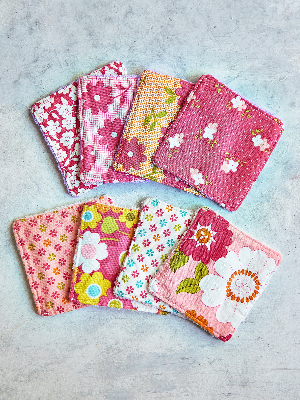 Set of 8 Reusable Facial Cleansing Pads.  Eco Friendly Soft Microfiber Fleece And Cotton. Machine Washable. Mesh Laundry Bag Included.